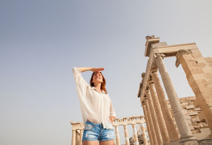 Acropolis ruins with woman in front NataliaD depositphotos